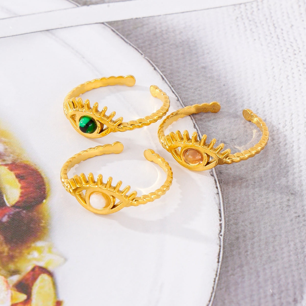 18k-gold-wisdom-eye-gemstone-inlaid-ring-shopngo-silo-image.jpg